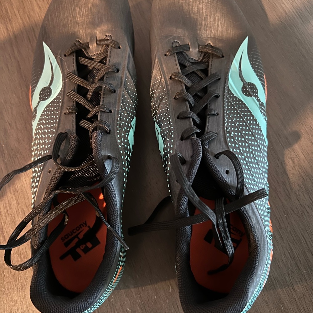 Saucony Black Running Shoes with Teal Accents and Orange Insoles